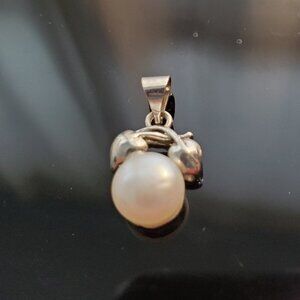 Pearl and silver pendant